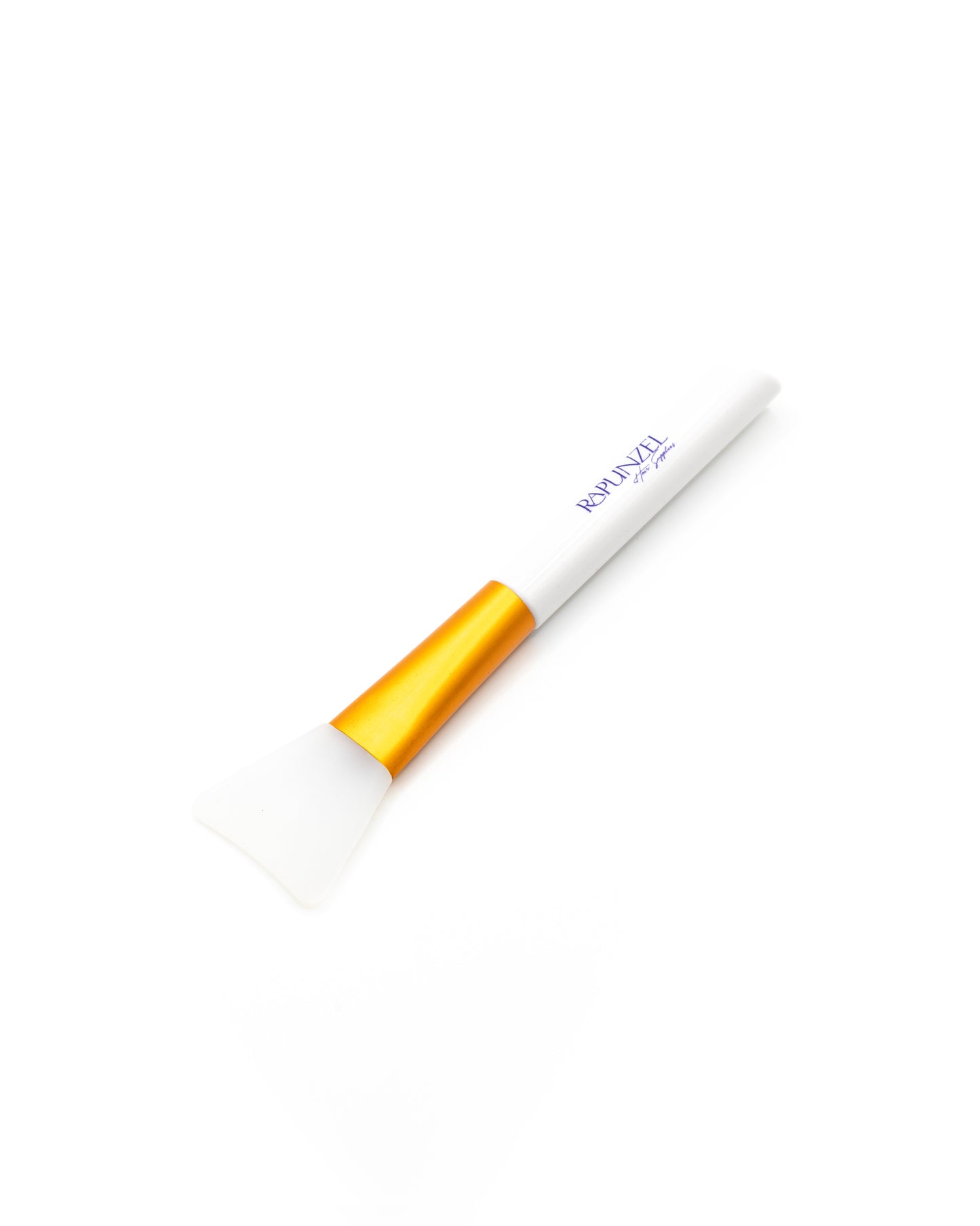 Makeup brush with gold ferrule and white handle on a white background