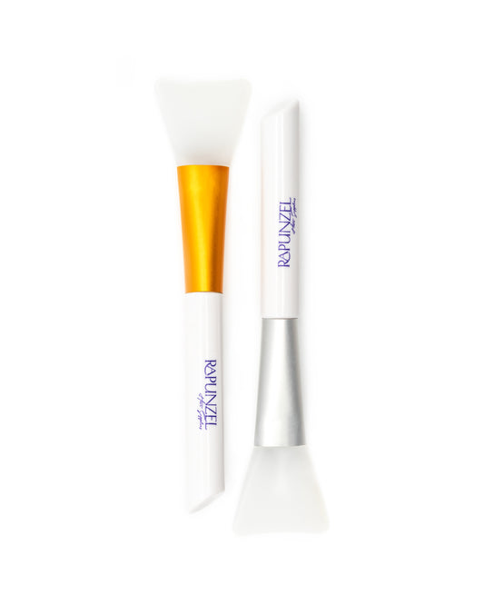 Two makeup brushes with 'Rapunzel' branding on a white background